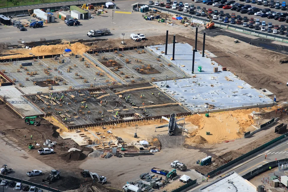 Construction Accelerates as Second Crane Arrives at Disney World's Monsters Inc. Roller Coaster Site